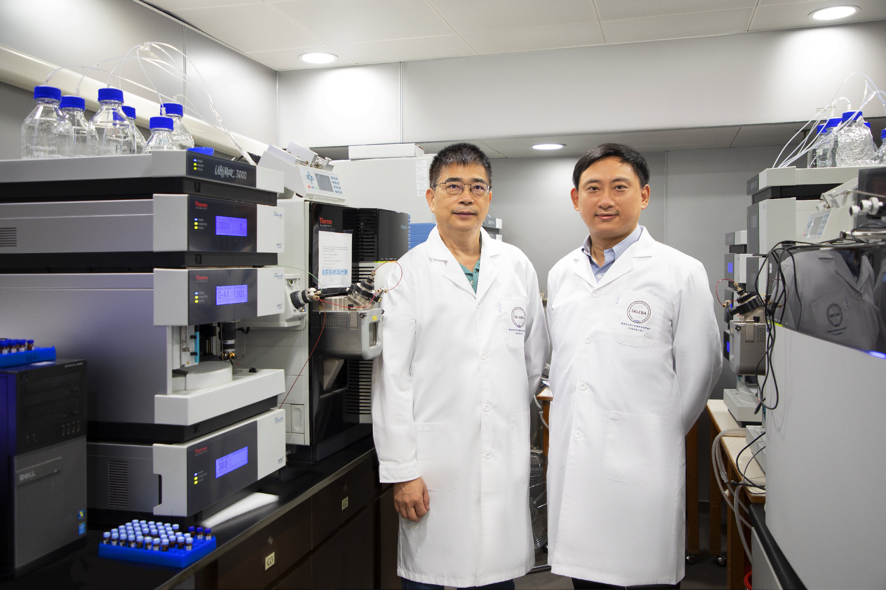 A research team led by Professor Cai Zongwei (left) and Dr Yang Zhu (right) has revealed the association between rapidly fading antibody levels in some recovered COVID-19 patients and a high plasma concentration of a metabolite called gly-pro and its producing enzyme.