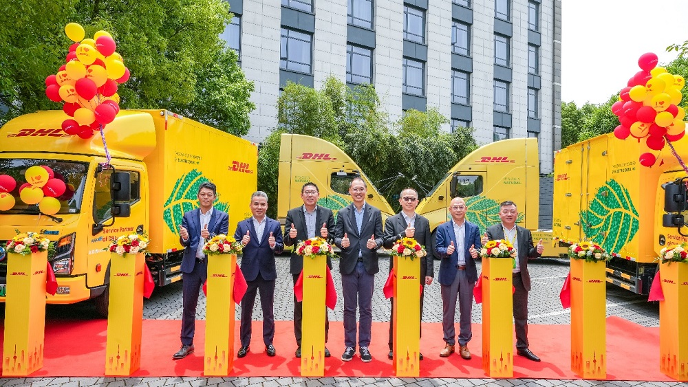 Ready, set, go electric! Executives at DHL Global Forwarding and honored guests inaugurates the new EVs with a celebratory ribbon cutting in Shanghai Left to right: Allen Chen, President of DHL Global Forwarding China Shanghai; Frank Zhu, General Manager of Wing Logistics; Piak Hwee Tan, Senior Vice President of Marketing and Sales, DHL Global Forwarding Asia Pacific; Kelvin Leung, CEO of DHL Global Forwarding Asia Pacific ; Steve Huang, CEO of DHL Global Forwarding Greater China; John Liu, Chairman of Global Express; Johnson Wong, President of DHL Global Forwarding East China