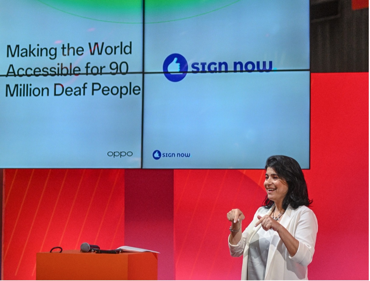Hila Almog, Head of Community of Sign Now, speaking with sign language