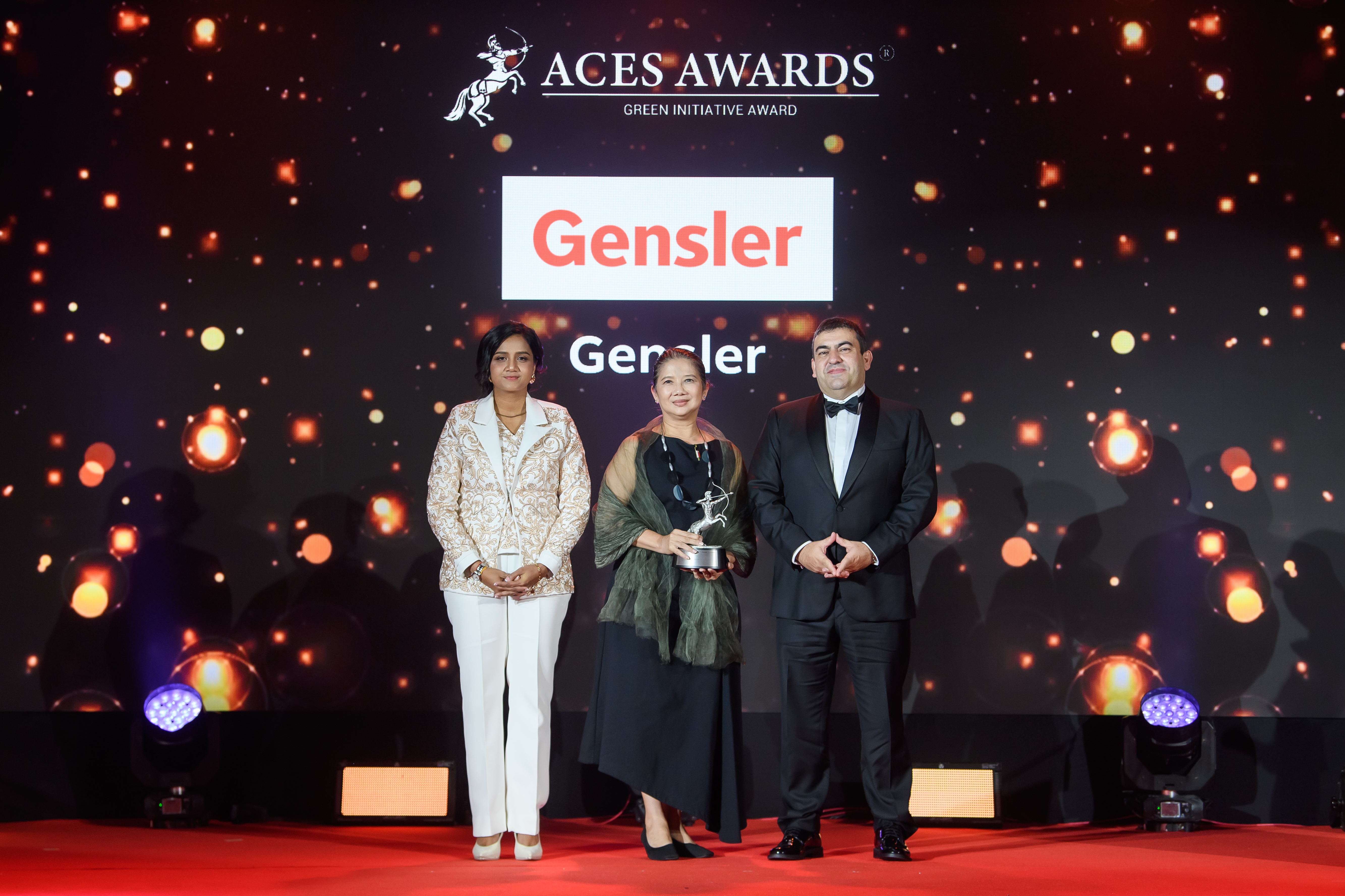 Tanya Suvannapong, Principal and Design Director of Gensler (centre), receiving the award in recognition of Gensler