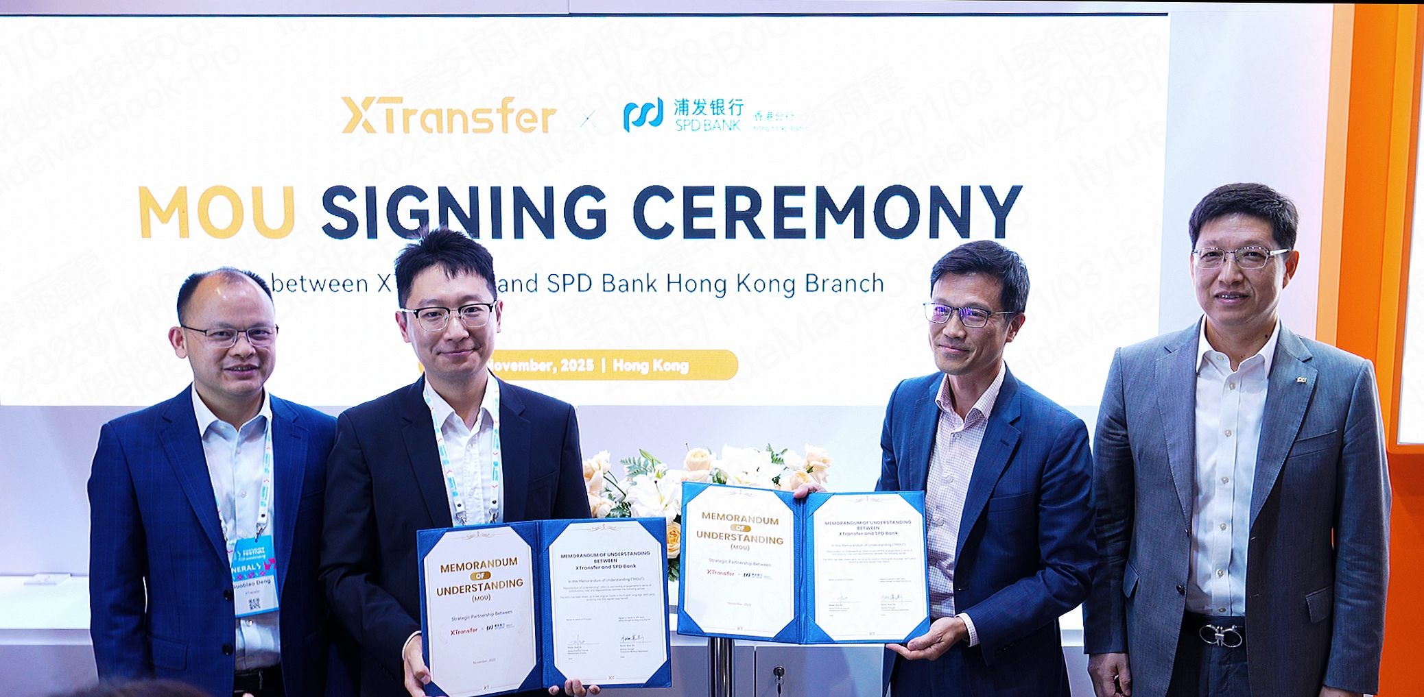 Bill Deng, Founder and CEO of XTransfer (From the Left), and Zhu Jun, Deputy Chief Executive Officer of Shanghai Pudong Development Bank Co. Ltd., Hong Kong Branch (From the Right) witnessed the official signing of a memorandum of cooperation at the XTransfer booth.
